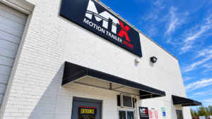 Motion Trailer Worx Greensboro NC dealership exterior with storefront sign and entrance